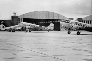 Planes belonging to Monarch Airlines near a hangar at Stapleton circa 1940. Image courtesy Stephen H. Hart Library & Research Center, History Colorado