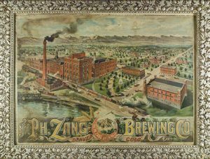Chromolithograph in original frame showing the PH. Zang Brewing Company in Denver c. 1890. Poster also shows mountains in the background with Mount of the Holy cross in the center at bottom. Image courtesy Stephen H. Hart Library & Research Center, History Colorado.